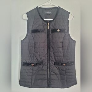 Black quilted vest with velvety details.